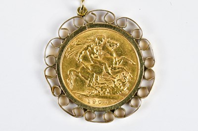 Lot 347 - An Edward VII sovereign, 1909, now in a scroll...