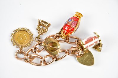 Lot 271 - A 9ct rose gold charm bracelet set with...