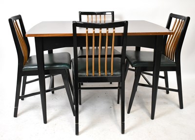 Lot 2607 - A mid-century ebonised teak extending dining...
