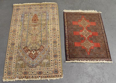 Lot 146 - A cream ground Persian style rug with...