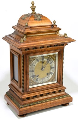 Lot 1383 - A late 19th century German walnut mantel clock...