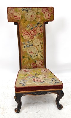 Lot 1619 - A Victorian carved walnut salon chair with...