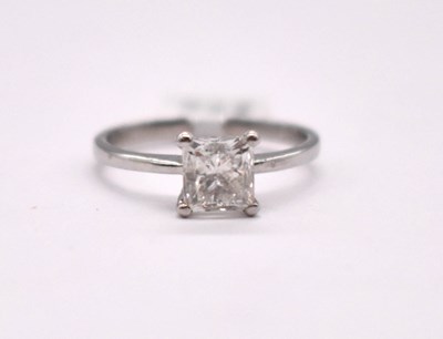 Lot 1098 - A platinum and diamond solitaire ring, the...