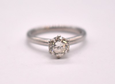 Lot 1101 - A platinum and diamond solitaire ring, the...