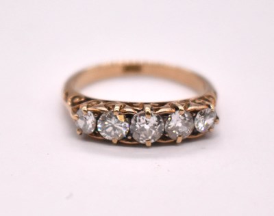 Lot 1102 - An 18ct yellow gold five stone diamond ring,...