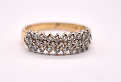 Lot 1103 - An 18ct yellow gold platinum tipped diamond...