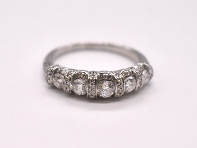 Lot 1106 - An Art Deco platinum diamond set ring with...