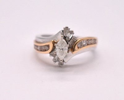 Lot 1107 - A 14ct yellow and white gold diamond cluster...