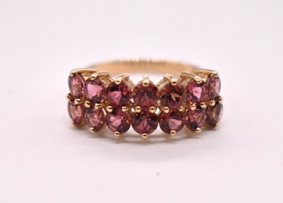 Lot 1109 - A 9ct yellow gold dress ring set with two rows...