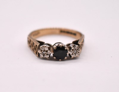 Lot 1111 - A 9ct yellow gold sapphire and diamond...
