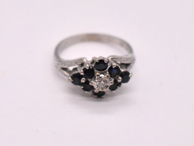 Lot 1113 - An 18ct white gold sapphire and diamond...