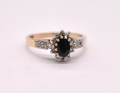 Lot 1115 - A 9ct yellow gold floral cluster ring centred...
