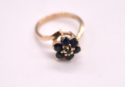 Lot 1118 - A 9ct yellow gold synthetic sapphire floral...