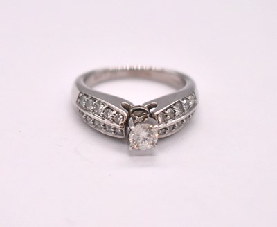 Lot 1119 - A 14ct white gold diamond cluster ring, the...