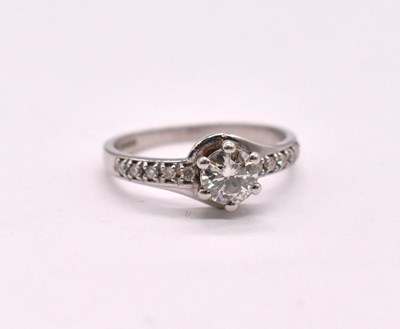 Lot 1124 - A 9ct white gold diamond solitaire ring, the...