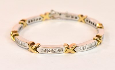 Lot 1130 - An 18ct white and yellow gold diamond line...