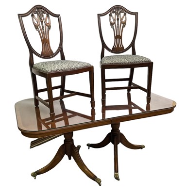 Lot 31 - A reproduction twin pedestal dining table,...