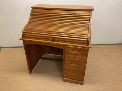 Lot 646 - A roll-top desk, height 117cm, width 107cm,...
