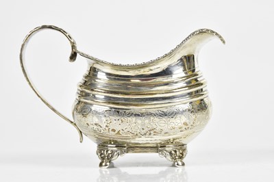 Lot 2063 - A George III hallmarked silver milk jug, with...