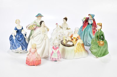 Lot 2713 - ROYAL DOULTON; a collection of nine figures...
