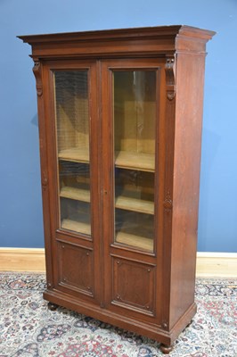 Lot 12 - A Victorian walnut bookcase, with moulded...