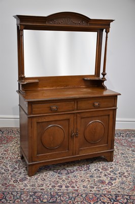 Lot 1040 - A 1920s oak mirror back sideboard, with carved...