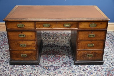 Lot 10 - A 19th century teak campaign kneehole desk,...