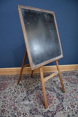 Lot 1076 - A vintage easel with removable blackboard,...