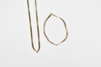 Lot 381 - A 9ct three tone gold flat link necklace and...