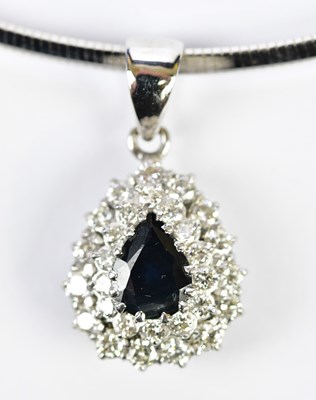 Lot 322 - An 18ct white gold collarette suspending an...