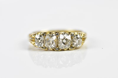 Lot 75 - An 18ct yellow gold four stone diamond ring,...