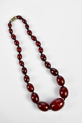 Lot 368 - A cherry amber beaded necklace, length 43cm,...