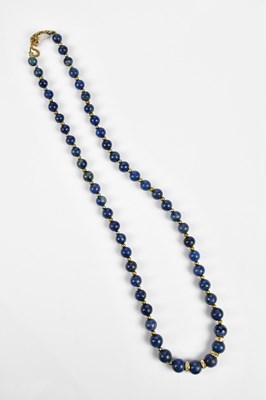 Lot 408 - A lapis lazuli beaded necklace with silvered...