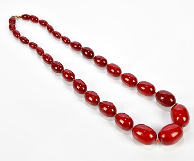Lot 346 - A large vintage hand tied cherry amber...