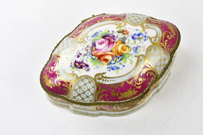 Lot 1457 - A modern porcelain trinket box of shaped oval...