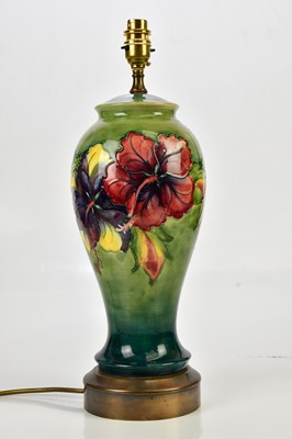 Lot 2221 - WALTER MOORCROFT; a table lamp in the...