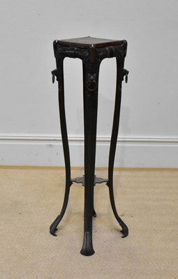 Lot 2050 - An Arts & Crafts cast metal jardiniere stand,...