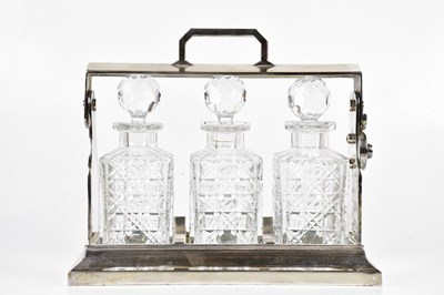 Lot 2015 - A silver plated tantalus in the manner of...