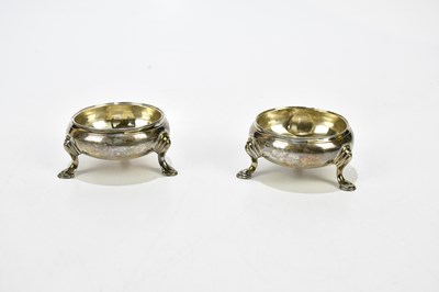 Lot 2178 - A pair of George III silver bun salts, marks...