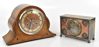 Lot 1385 - An Arts and Crafts silver plated mantel clock...