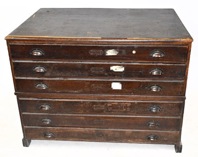 Lot 1751 - An oak six drawer plan chest on block legs,...