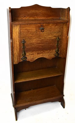 Lot 1713 - An early 20th century Arts and Crafts oak...