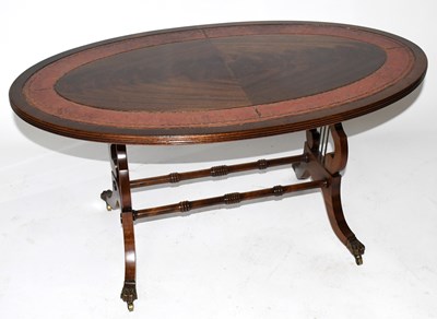 Lot 1733 - A reproduction mahogany veneered low coffee...