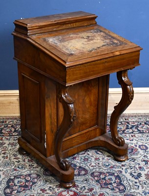 Lot 26 - A Victorian walnut Davenport, with side door...