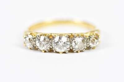 Lot 92 - An 18ct yellow gold five stone graduated...