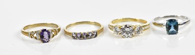 Lot 247 - Three 9ct yellow gold modern dress rings and a...