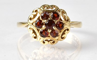 Lot 719 - A 9ct yellow gold garnet cluster ring, size U,...