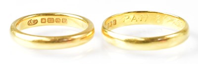 Lot 695 - Two 22ct yellow gold wedding bands, sizes Q...