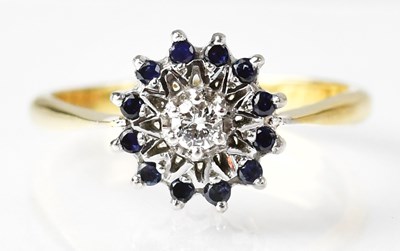 Lot 699 - An 18ct yellow gold diamond and sapphire...