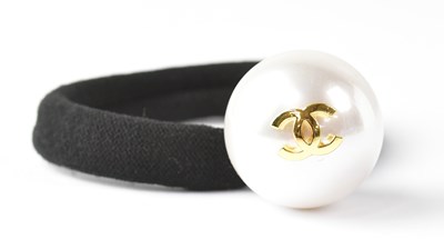 Lot 418 - CHANEL; a hair bobble with a large pearlised...